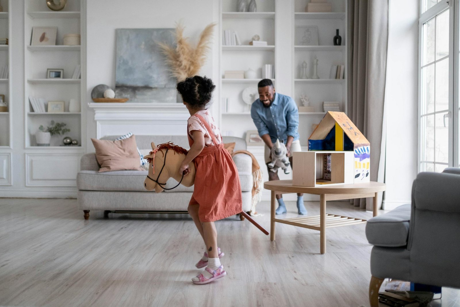 Father and Daughter Playing in the Living Room