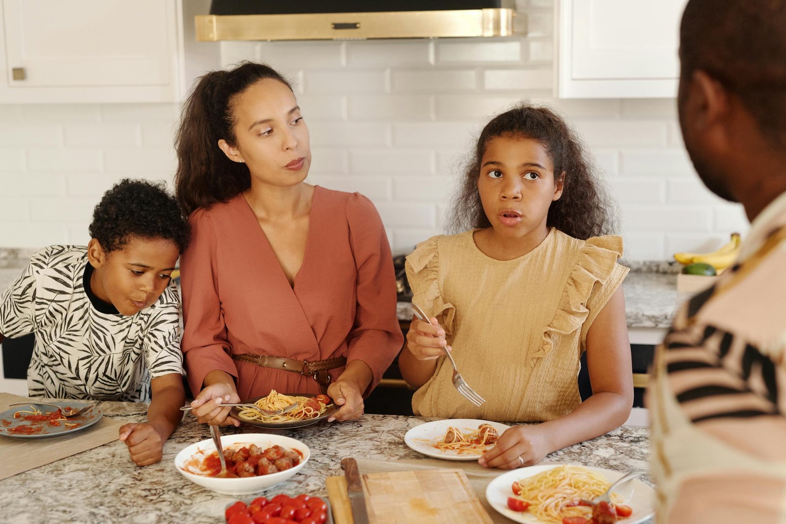 Family Eating Breakfast in a Kitchen